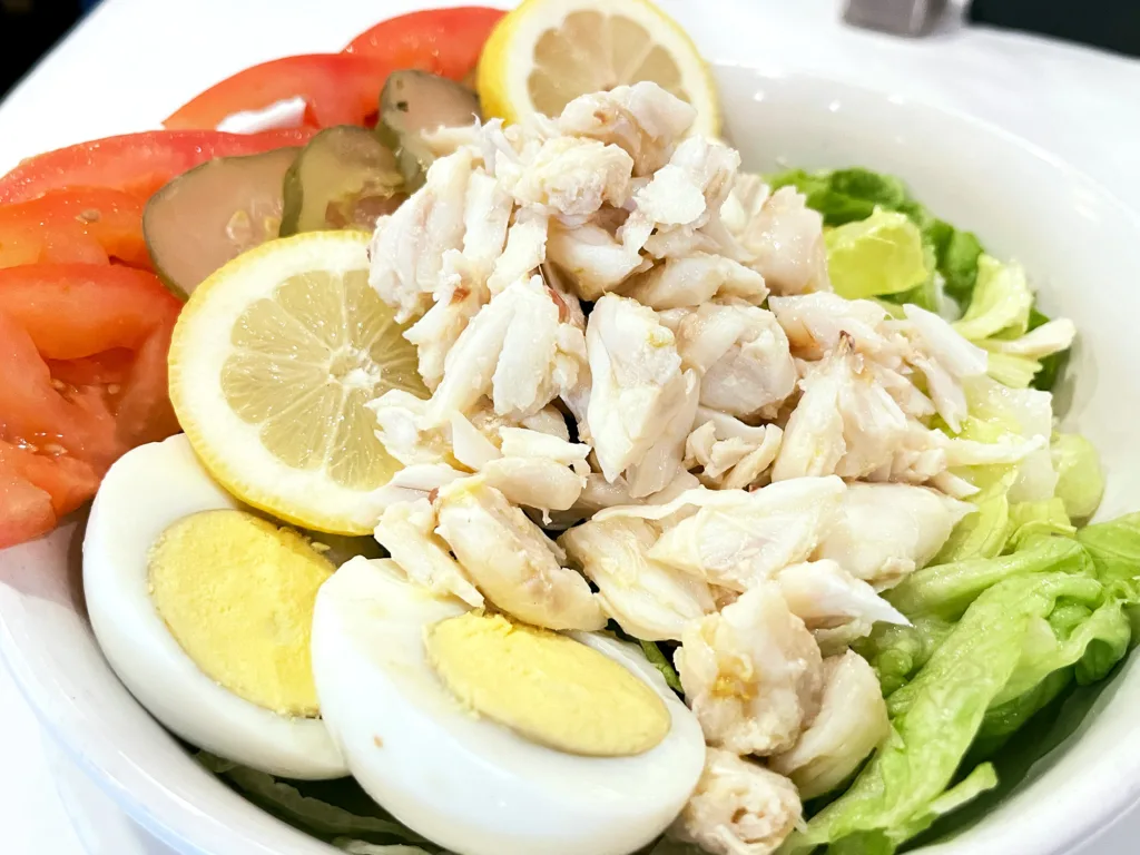 Fresh Louisiana jumbo lump crabmeat salad with iceberg lettuce, asparagus, and boiled shrimp at Fury’s Restaurant in Metairie